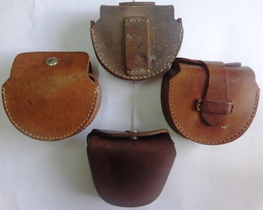 Figure 14. Leather cases, the top three are Japanese military for the Type 5. The (left) has a snap fastener, (right) has a tongue and loop closure. At top a rear view showing belt loop, this often has the owners name written on it. At bottom is a 1960s Chinese folding goggles case for comparison.